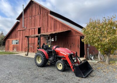 Yanmar YT235 Tractor in front of Barn